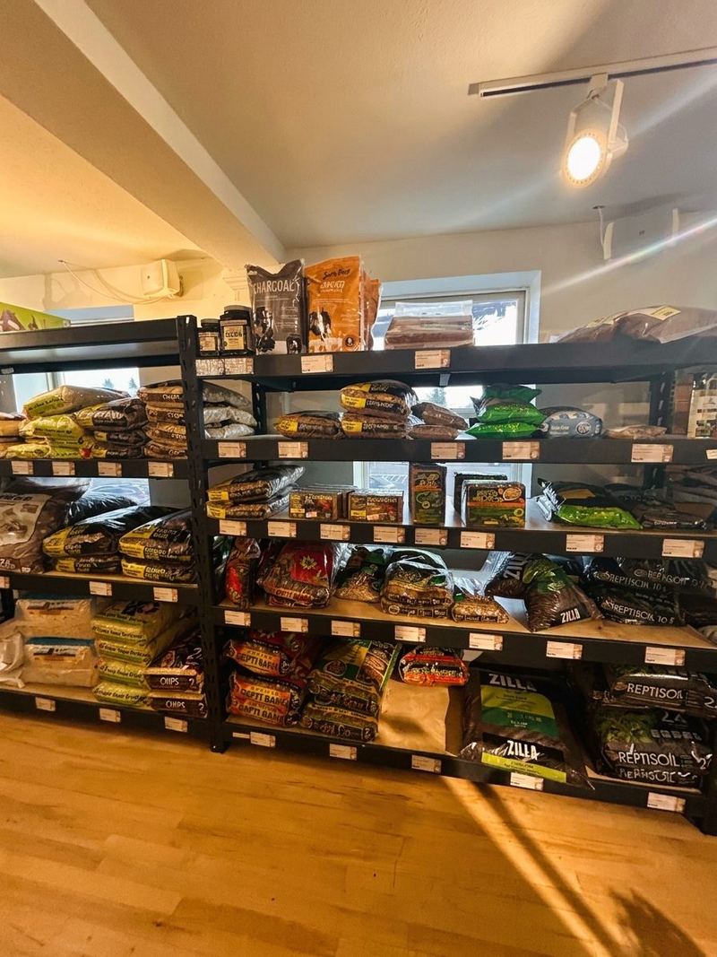 Shelves of bagged bedding, substrate and hay